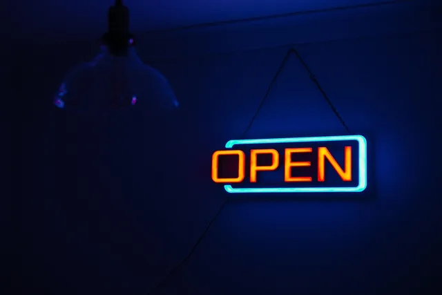 open sign, neon lights, illuminated, signage, dark, light, neon, neon sign, open, sign, open sign, neon, neon, neon, neon, open, open, open, open, open. Quebec French language rules for a cleaning business: signs, quotes and invoices